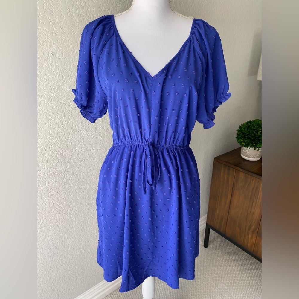 New, never worn staccato dress size medium. Lined, hits just above knee